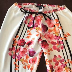 Casual or dressy pant with tie up waist.